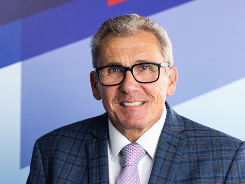 Older professional man in blue suit with a friendly smile 
